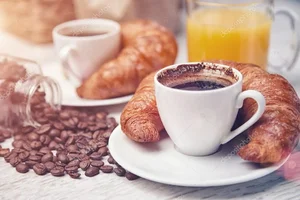 depositphotos_43739953-stock-photo-cups-of-coffee-with-croissants.webp