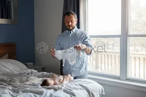 stock-photo-middle-age-caucasian-father-changing-diaper-clothes-for-newborn-baby-daughter-son...webp