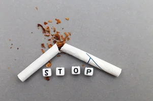broken-cigarette-with-word-stop-gray-background-close-stop-smoking-concept_427957-1215.webp
