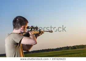 young-man-took-aim-your-450w-197420423[1].webp